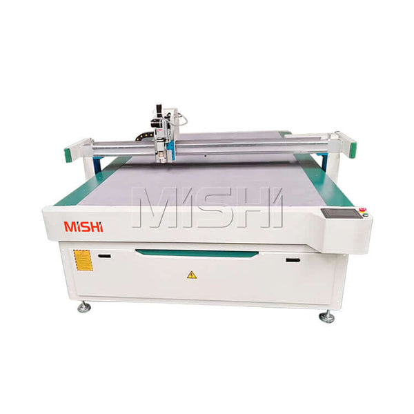 High-speed oscillating knife cutting machine for leather, rubber, and textiles in the automotive industry.